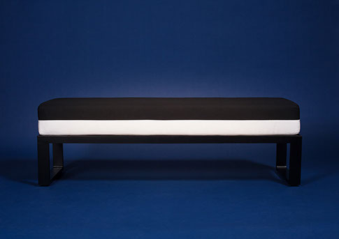 XXX Tabouret and Coffee Table XXX Tabouret aluminum black and white tabouret and pillow from side